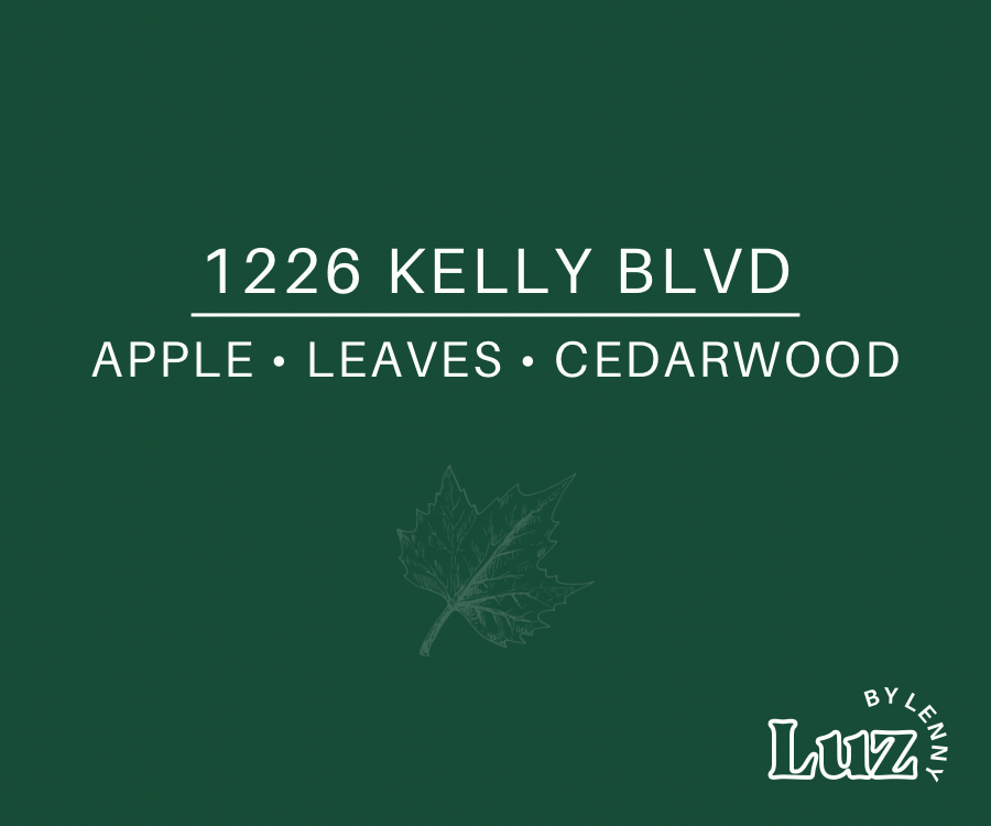 Deep green label reading “1226 Kelly Blvd” and “Apple • Leaves • Cedarwood,” with a subtle maple leaf illustration and Luz by Lenny logo.