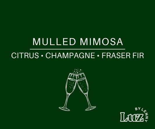 Dark green label reading “Mulled Mimosa” and “Citrus • Champagne • Fraser Fir,” with clinking champagne flutes and the Luz by Lenny logo.